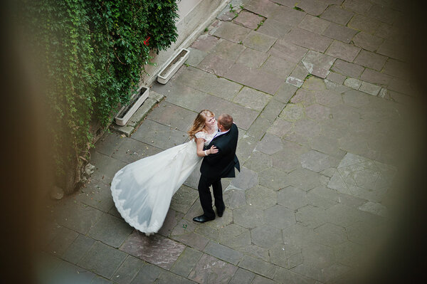 groom circling  his bride view from high