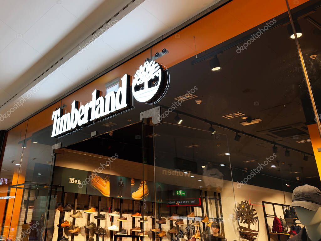 Manchester, UK - September 26, 2025: Bright Timberland storefront highlighting brand logo, showcasing rugged boots and a modern retail atmosphere inside.