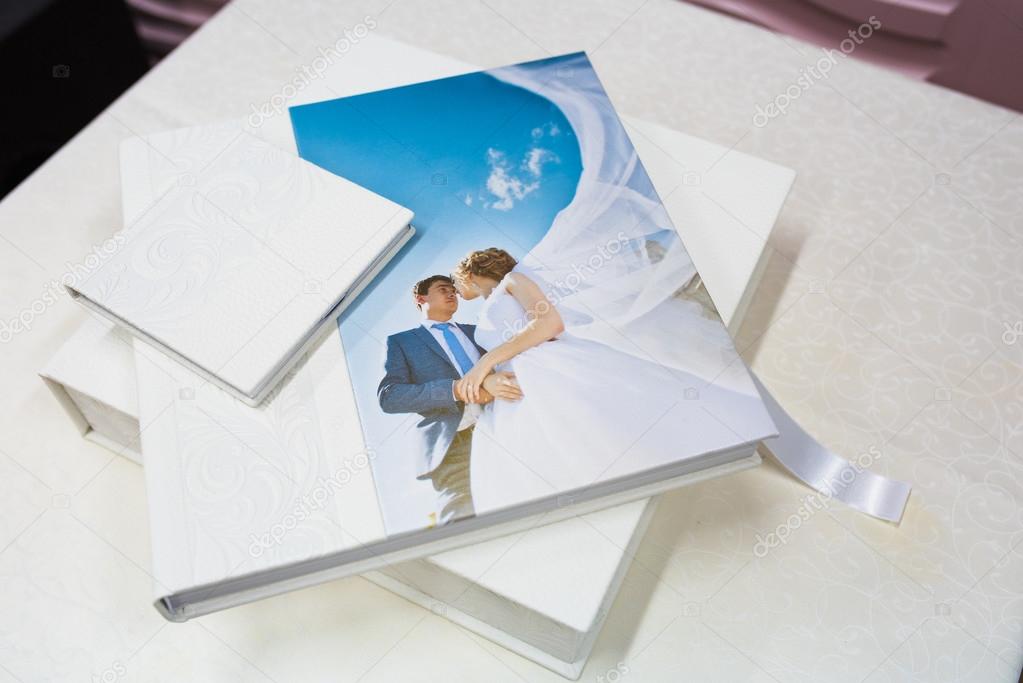 Classic white leather wedding photobook and album