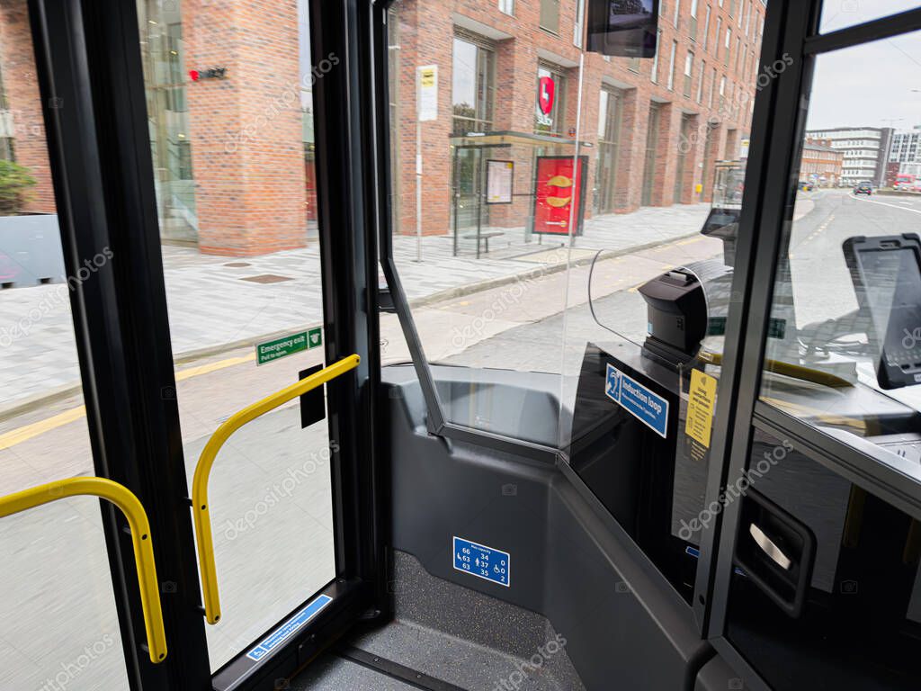 Manchester, UK - September 29, 2025: A bus cockpit view from Manchester shows an urban street scene and modern transit atmosphere.