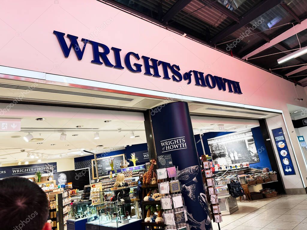 Dublin, Ireland - October 24, 2025: Interior view of Wrights of Howth gift shop in Dublin, Ireland with displays, customers, and blue branding.