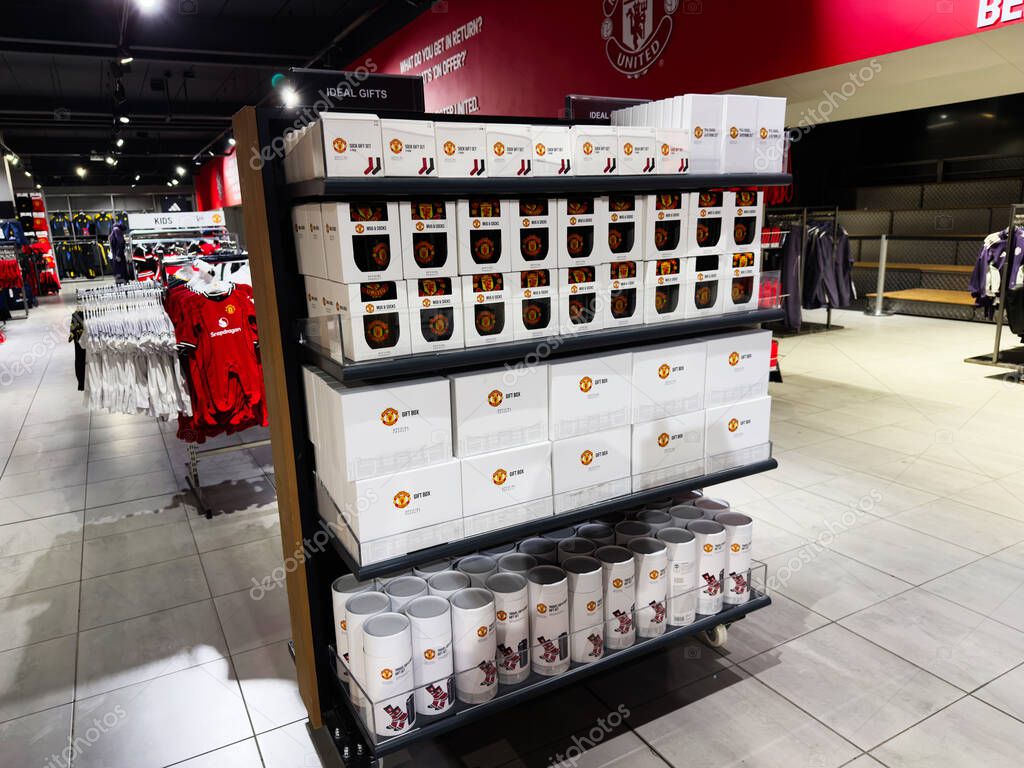 Manchester, UK - September 30, 2025: Retail scene in Manchester showing a neatly arranged gift and mug display for Manchester United.