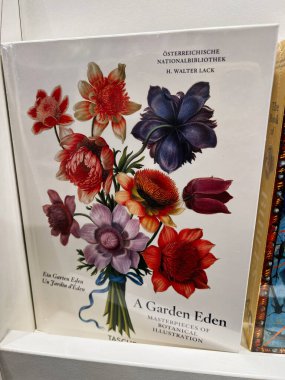 Londra, İngiltere - 12 Aralık 2025: Bir kitap kapağından renkli botanik deseni çizimi, canlı çiçekler ve zarif tasarım.