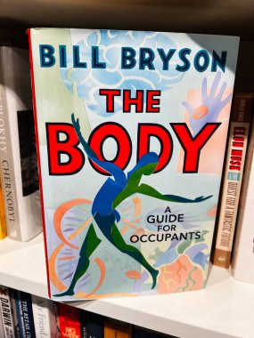 Londra, İngiltere - 12 Aralık 2025: Birim 'in kitap kapağı, insan vücudu hakkında esprili bir bilim rehberi olan Bill Bryson.