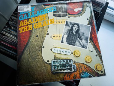 Lviv, Ukrayna - 07 Şubat 2026: Rory Gallagher için 1975 Albüm kapağı gitar ve retro rock havasıyla.