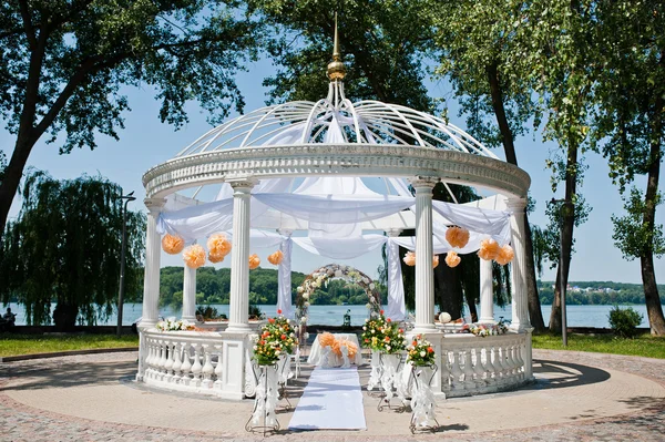 Wedding arch with chairs and many flowers and decor — Stock Photo, Image