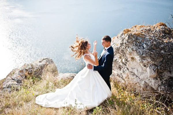 Very sensual and gorgeus wedding couple on the picturesque lands Stock Photo