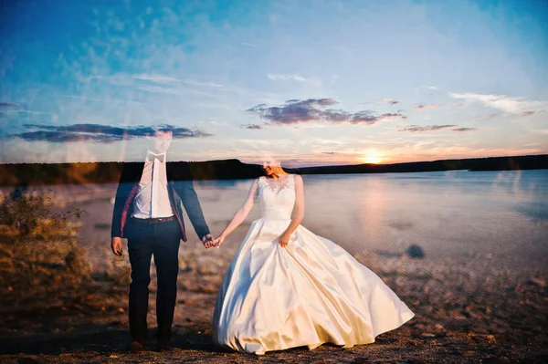 Multiexposition of very sensual and gorgeus wedding couple on th — Stock Photo, Image