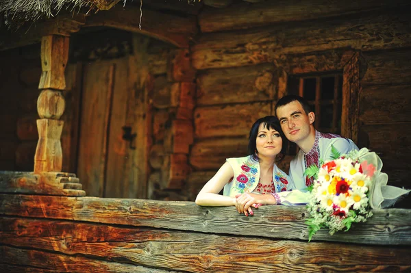 Happy young couple in national dress — Stock Photo, Image