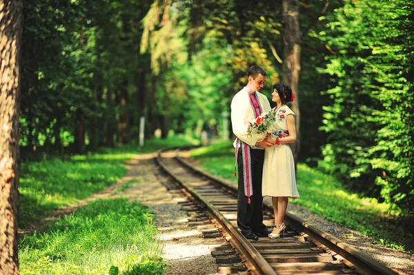 Happy young couple in national dress — Stock Photo, Image