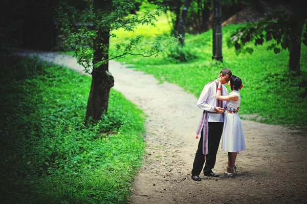 Happy young couple in national dress — Stock Photo, Image