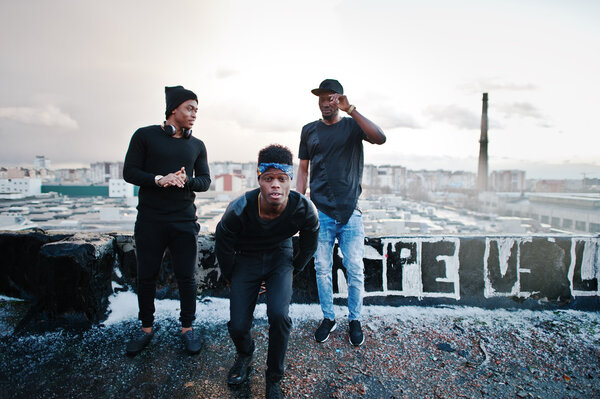 Three rap singers band on the roof