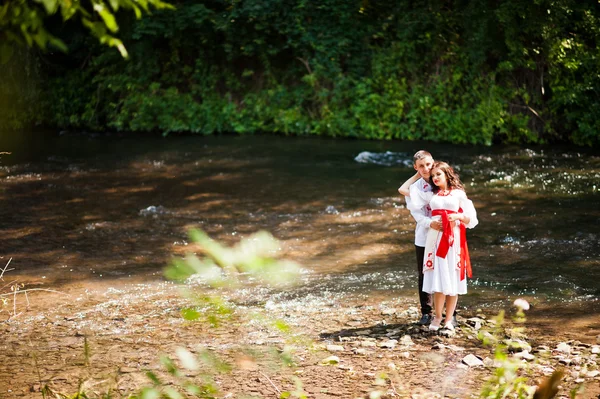 Love story of loving couple in national Ukraine dress. Near the — Stock Photo, Image