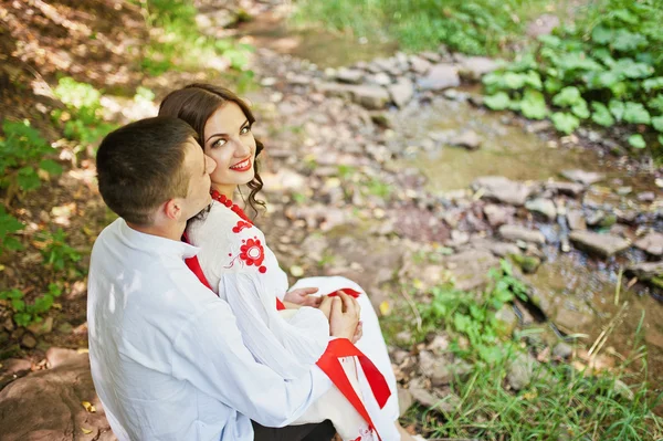 Love story of loving couple in national Ukraine dress. On the wo — Stock Photo, Image