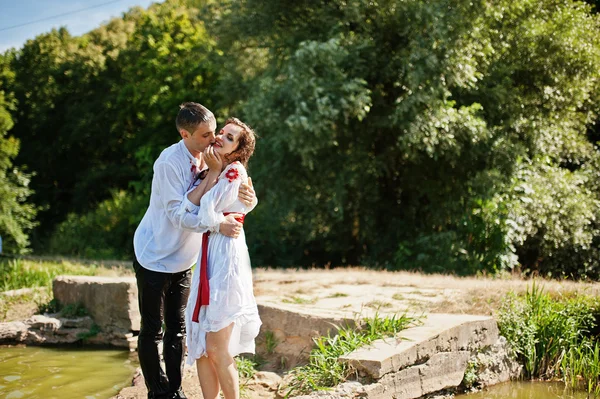 Love story of loving couple in national Ukraine dress. Jumpimg o — Stock Photo, Image