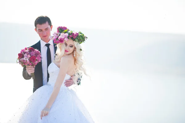 Close up portrait of charming bride in a wreath and elegant groo — Stock Photo, Image