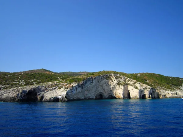 Excursion around the island of Zakynthos on a pleasure boat. Rocky shores of white limestone. White sand beaches. Greece