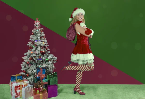 Girl Santa Claus Dress Standing One Leg Next Christmas Tree — Stock Photo, Image