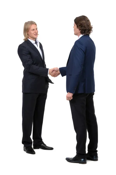 Beyaz arka planda izole edilmiş ve el sıkışan iki işadamı.