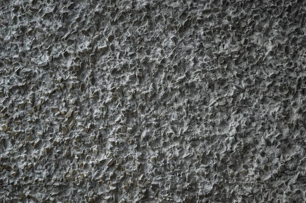 decorative coating with fine stone abrasive, dark background