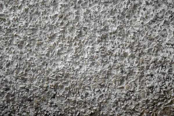 decorative coating with fine stone abrasive, dark background