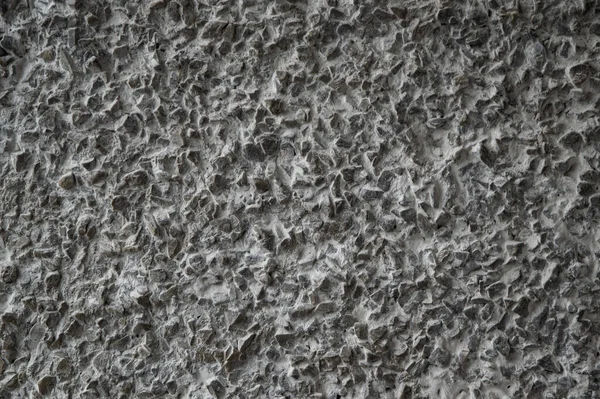 decorative coating with fine stone abrasive, dark background