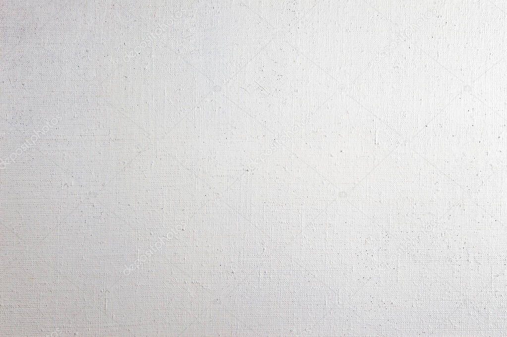 creative background: whitewashed primed linen for oil painting, stains of white primer paint 