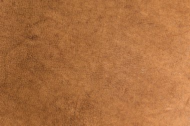 Deri grunge arka plan: eski bir parça sert deve derisi, sürtünme, benekler, yaralar