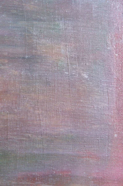 abstract colored creative background - rough linen canvas unevenly covered with multi-colored primers, reflections of light. Toning, blurring, selective focus. Temporary object.