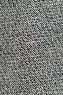 koyu yaratıcı arkaplan: siyah astarlı keten tuvalin ters tarafı, düz olmayan ışıklandırma, renk tonlama 