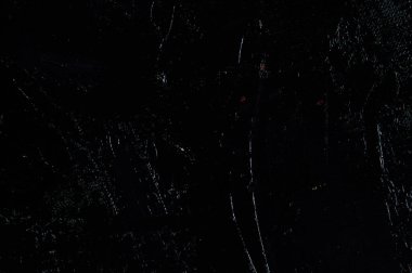 Karanlık yaratıcı arka plan, pürüzlü keten branda siyah astar ile örtülü, ışığın yansımaları. Tonlama, bulanıklaştırma, seçici odaklanma. 