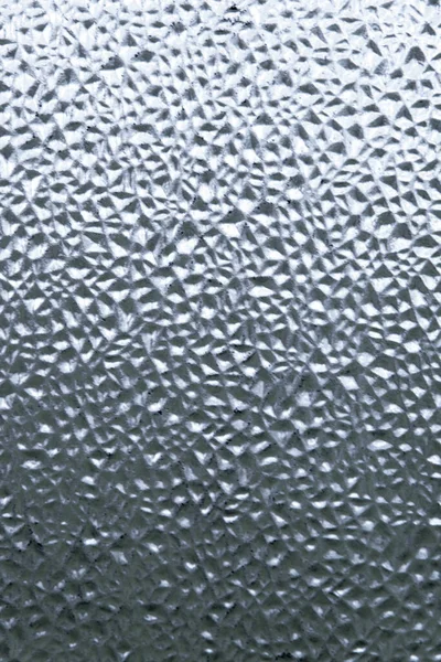 refreshing background: imitation of dew on a transparent surface, color toning, short focus.