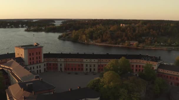 Drone view over Vaxholm kastell in sunset, Stockholm archipelago — 비디오