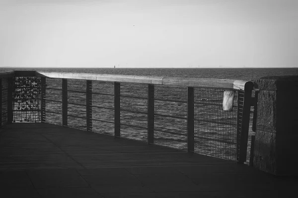 210501 Malmo Sweden - Black and white photo over pier of love locks. — стокове фото