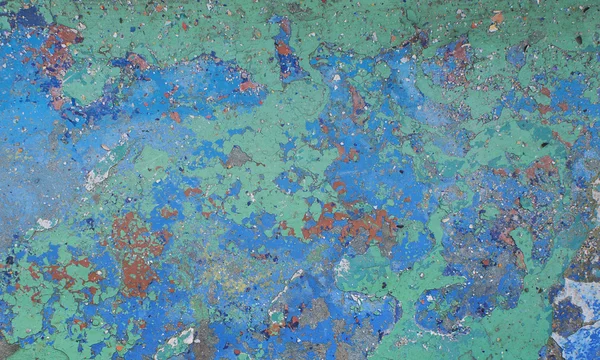 Duvardaki pürüzsüz dokudaki boyayı soyuyordum. Kırsal mavi grunge maddesi deseni.