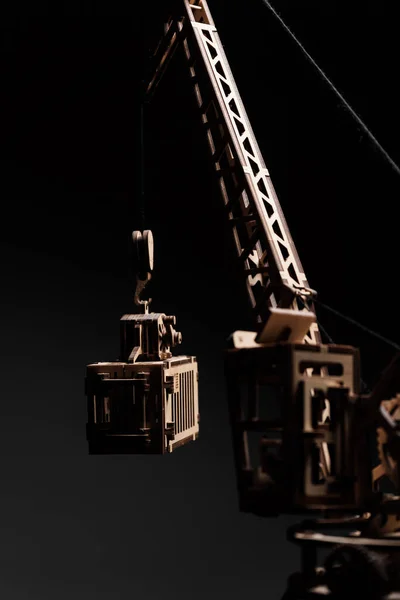 Port crane made of wood on a black background — Stock Photo, Image