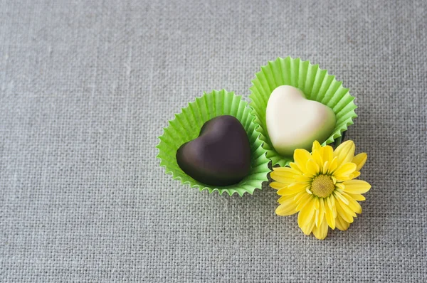 Two heart-shaped chocolates — Stock Photo, Image