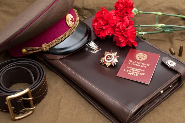 Still life with vintage objects dedicated to Victory Day. Order of the patriotic war 1st class — Stock Photo, Image