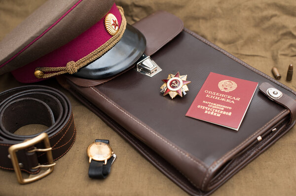 Still life with vintage objects dedicated to Victory Day. Order of the patriotic war 1st class. May 9