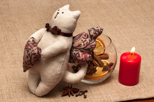 Composition: cat toy, bowl with spices and lit candle. — Stock Photo, Image