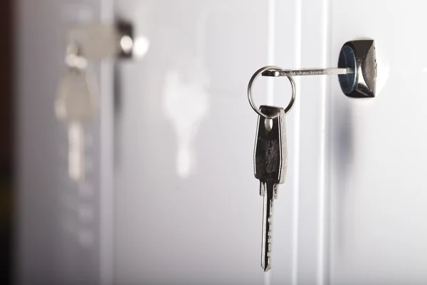 Keys in the keyhole closeup — Stock Photo, Image