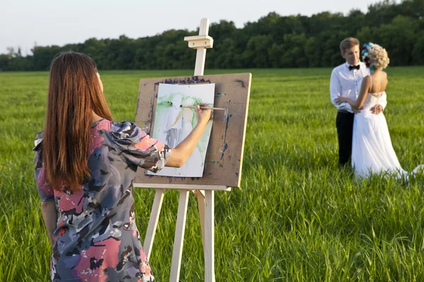 Művész festőállvány a szabadban, és a pár — Stock Fotó