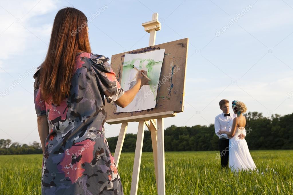 artist easel outdoors and the couple