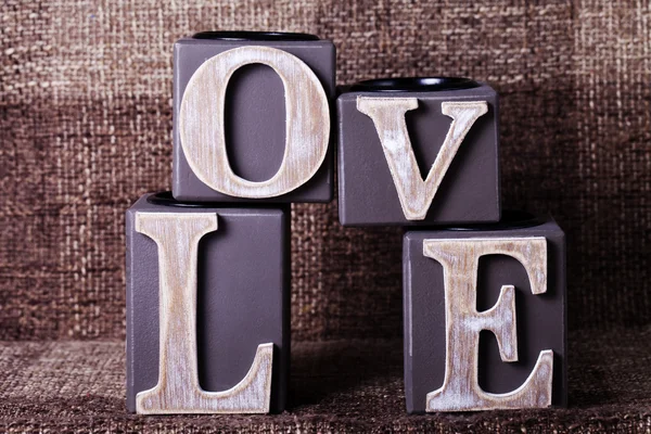 Word love from cubes on a brown background — Stock Photo, Image