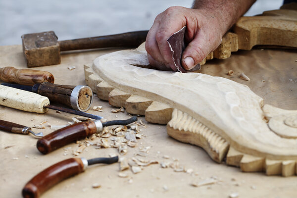 wood carvings, tools and processes work closeup