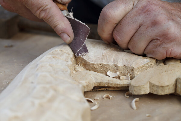 wood carvings, tools and processes work closeup