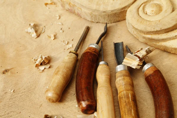 Carving tool closeup on wooden background — Stock Photo, Image