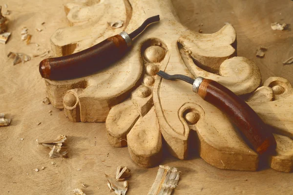 Carving tool closeup on wooden background — Stock Photo, Image