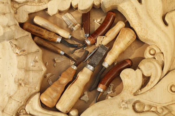 Carving tool closeup on wooden background — Stock Photo, Image