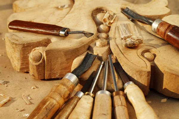 Carving tool closeup on wooden background — Stock Photo, Image